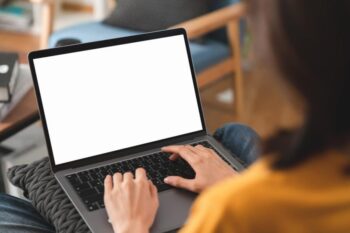 Typing on a laptop